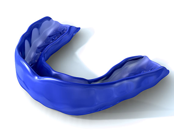 a blue child's mouth guard on a white background