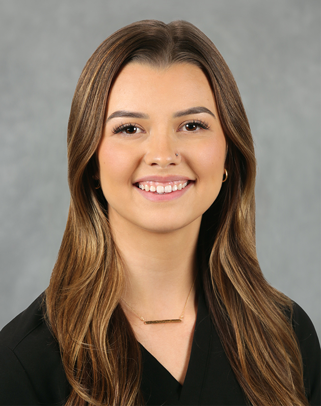 A headshot of Jessica who has long light brown hair.